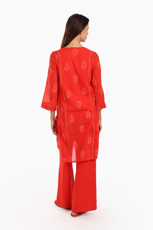 Embroidery tunic with contrast color piping in printed cotton voile